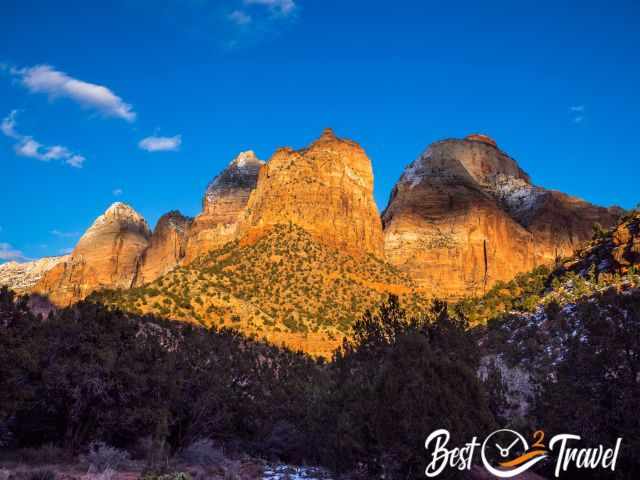 The orange burning sandstone mountains shortly before sunset.