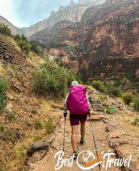 A hiker on the Bright Angel Trail during heavy rainfall 