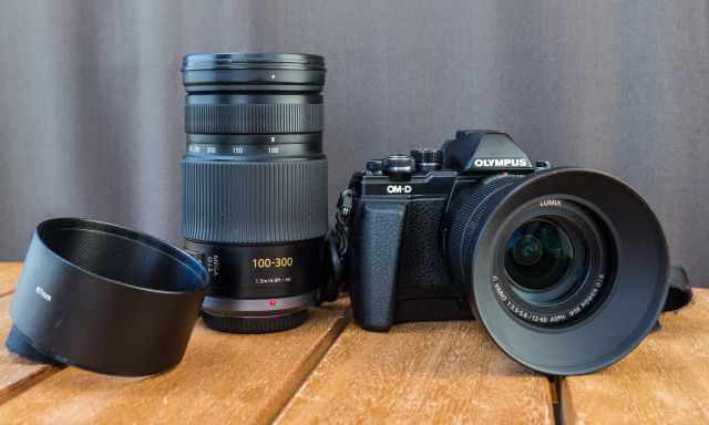 Olympus OM-D 10 camera and lenses on a table