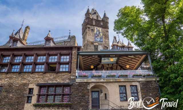 View in front of the castle to the pub and the highest tower.