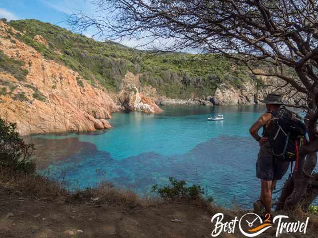 A hiker admiring the beautiful view to the sea.