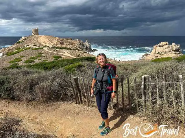 A hiker at the Genoise Tower d'Omigna.