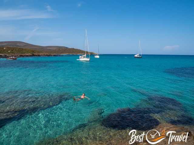 A bath in the Mediterranean and boats in the bay.