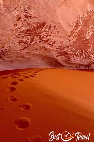 Footprints in the Cosmic Ashtray in the red sand