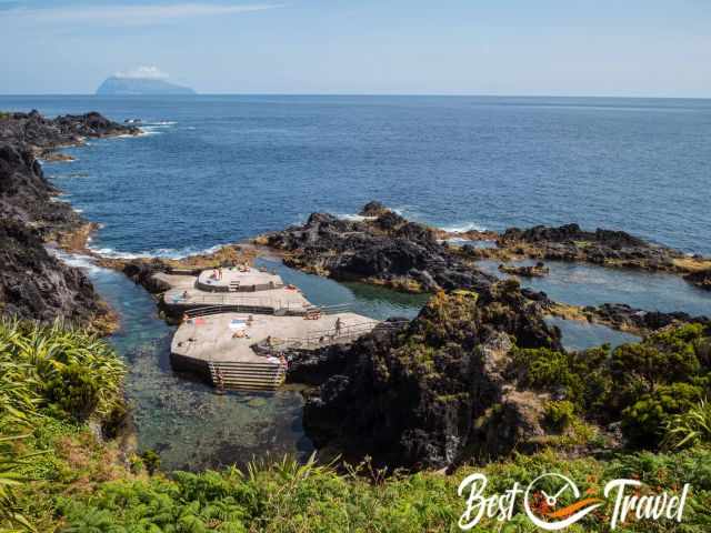 Several natural pools and Corvo in the back.