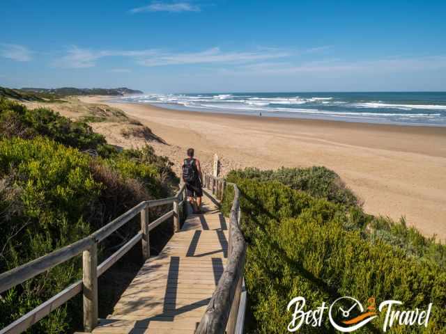 A visitor on the boardwalk which leads to Swartvlei Beach