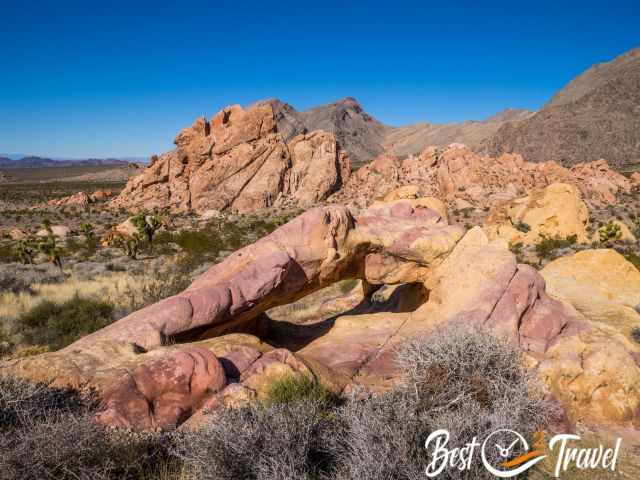 Rock formations in orange, pastel, and yellow at Whitney Pocket