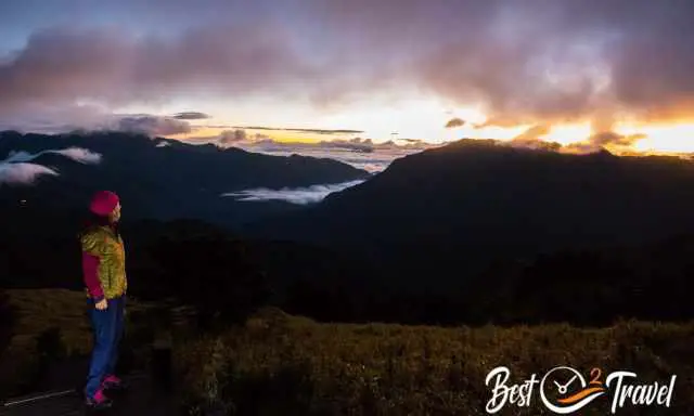 A woman on the staircase path to the summit of Hehuanshan