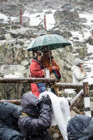 Visitors with winter clothes for snow, rain and hail.