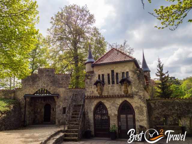 A small building with turrets in the courtyard