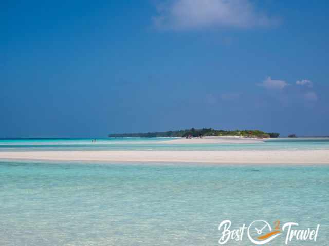 The turquoise water, the white sandy beaches and a few bathers.