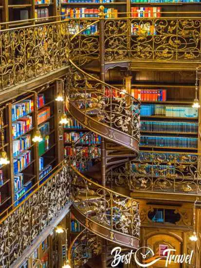 The richly ornamented spiral staircase inside the library.