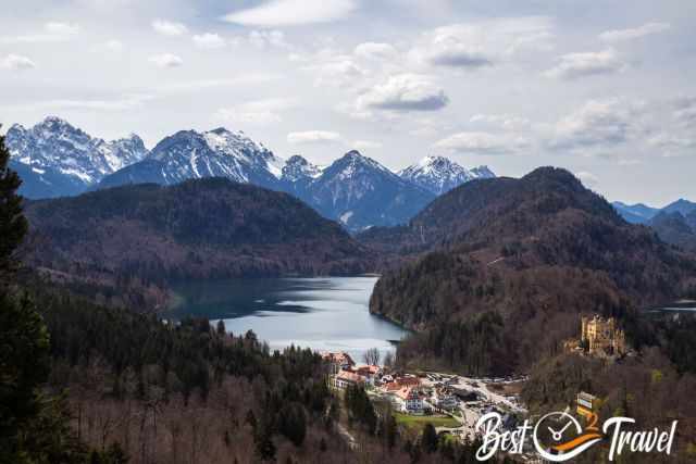 Hohenschwangau Castle, Lake Alpsee and snow capped mountains