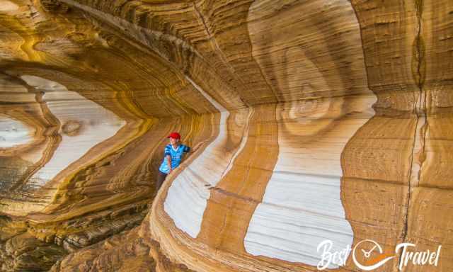 A woman standing between the Painted Cliffs