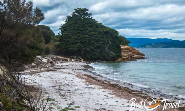 A railing leading to the beach and a path to the Painted Cliffs