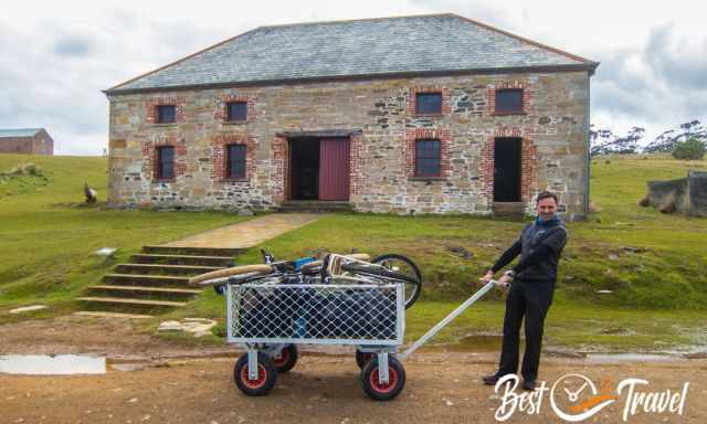 The ranger station and a visitor in front with heavy luggage