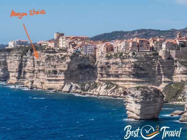 An arrow shows the staircase which is carved into the cliffs.