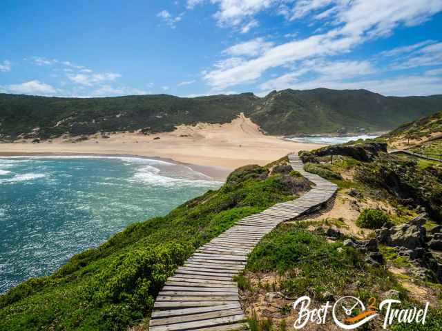 A wooden boardwalk above a dune