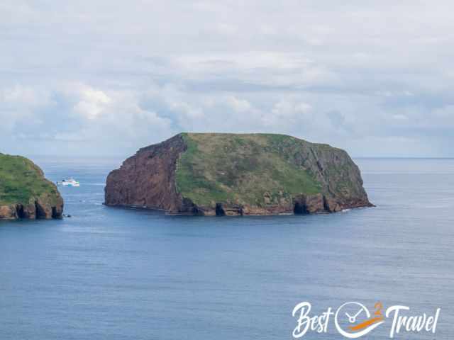 A ferry between two rocks to the harbour in Terceira