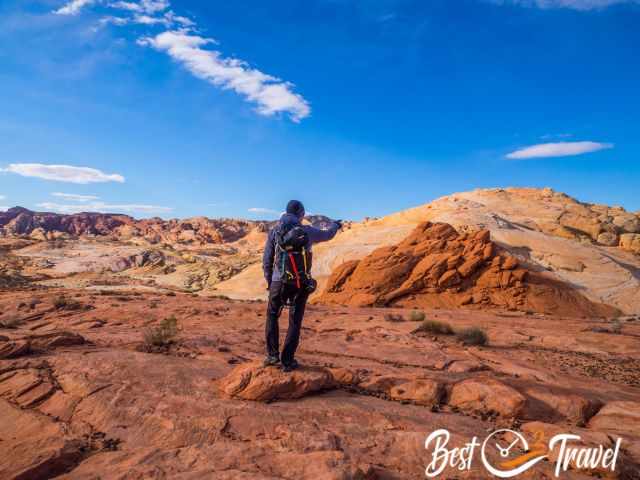 A hiker on the Fire Wave trail in warm clothes